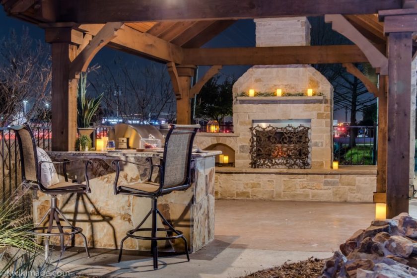 Custom fireplace, grill and outdoor seating area