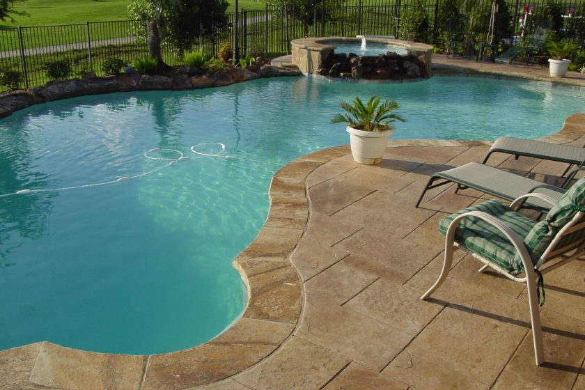 Freeform Pool and Raised Spa with Pattern Concrete