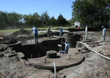 Freshly applied gunite shell for a freeform pool and spa before plaster