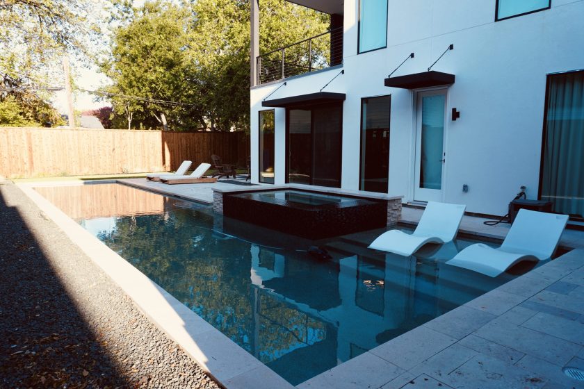 Geometric pool with raised tile spa and tanning ledge